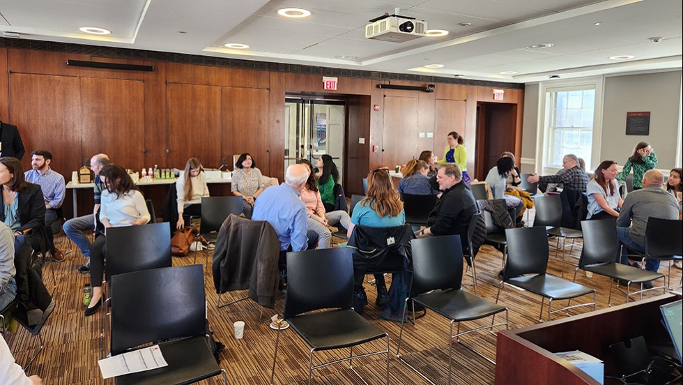 several people seated in a room